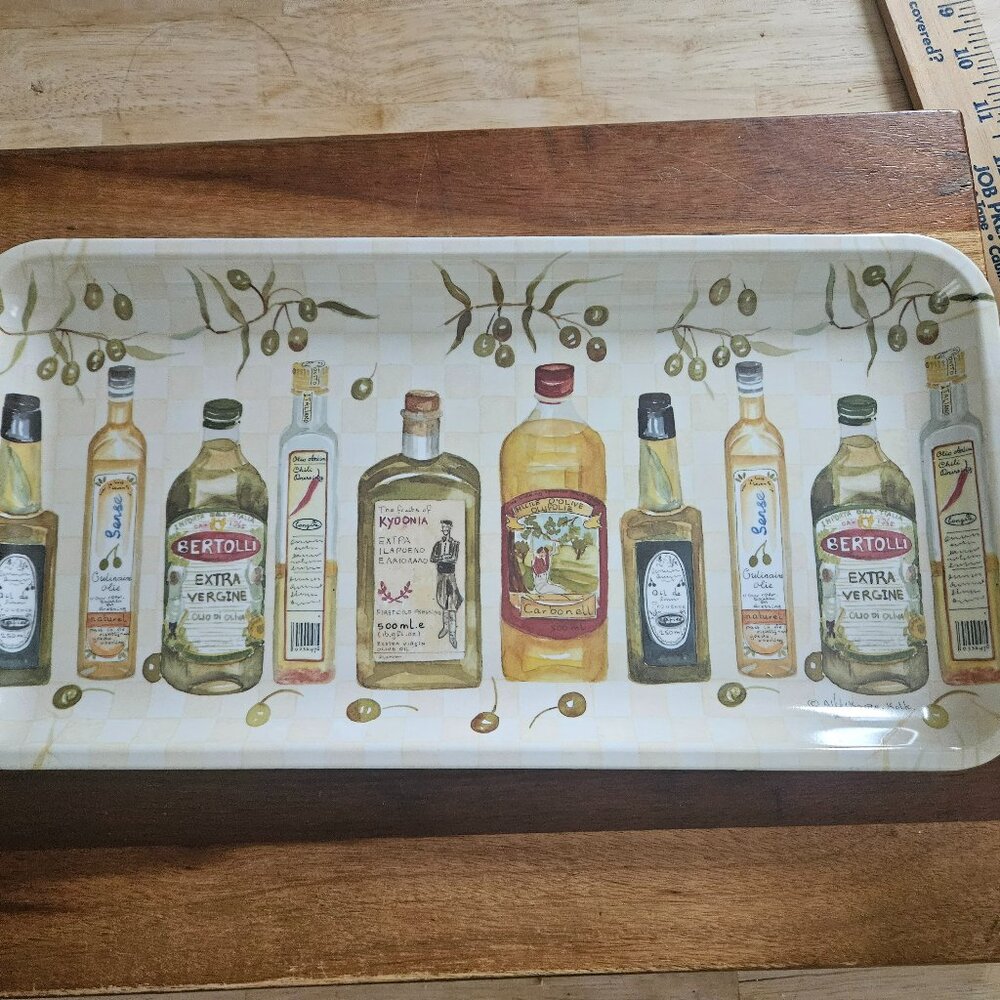 tray made in Italy has different olive oil motifs signed